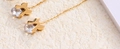 Elegant gold titanium steel clover tassel drop earrings with sparkling white zircon accent - Ribbon Bow Gold