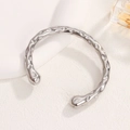 Minimalist silver hammered stainless steel open bangle with a polished textured finish - Steel