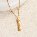 Collar de acero de titanio dorado con colgante de textura vertical y pequeñas cuentas oro - Oro I