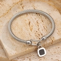 Pulsera de cable trenzado plateado con hebilla de herradura y candado de números romanos - Números Romanos Acero