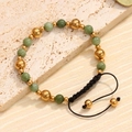 Pulsera artesanal de aventurina verde con cuentas doradas y cordón negro ajustable - Estilo Aventurina Verde