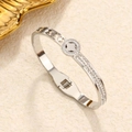Silver stainless steel open bangle with crystal pavé and clover floral cutout design - Steel