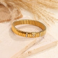 Pulsera elástica dorada con pieza central de corazón y brillantes cristales blancos - Estilo con Diamante Corazón / Dorado