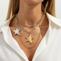 Detail view of multi-layered gold and silver necklace with polished star pendants on model - Mixed Color Necklace 7543