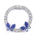 Detail of silver Cuban link anklet featuring pave rhinestones and blue crystal butterflies - Silver/Blue Zirconia