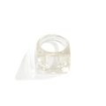Macro detail of clear square resin ring showing thick transparent acrylic material - Clear