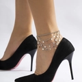 Close-up of layered silver anklet with metal sequins on a model wearing high heels - Silver Multilayer Sequin Style (0805)