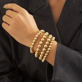 Layered 4-piece gold beaded bracelet set with high-polish metallic finish for women - Gold Bracelet (0989)