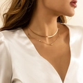 Double-layer gold snake chain necklace with small star charms worn on a female model - Gold Star Style (3151)