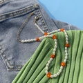 Collana girocollo con perle barocche e fiori arancioni con catena a estensione dorata - Arancione (4187)