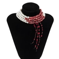 Detail of layered pearl choker with red marble bead tassels on black velvet bust - Style 1 Necklace White (5380)
