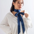 Close-up of a dark blue satin choker necklace tied in a bow over a white collared shirt - Necklace Style (0756) / Sapphire Blue