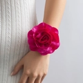 Detail of a large rose-shaped fabric choker in fuchsia pink with pleated satin texture - Bracelet Style (2124) / Rose Red