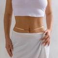 Detail view of a double-layered gold snake chain and beaded body chain on waist - Layered with Bead Decoration (4085) / Gold