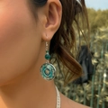 Detail of vintage bohemian dangle earring with green bead and mandala charm on model - Mandala Pattern (2920) / Silver Lake Green Mandala