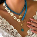 Detail of bohemian layered necklace with cowrie shell, blue beads and gold sea turtle pendant - Gold 3 (234346)