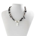Detail of beaded necklace with irregular crushed stones, pearls and white mushroom charm - Black And White Mushroom Gravel Style