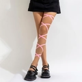 Detailed view of pink criss-cross elastic leg chain on thigh for fashion styling - Single Pink Leg Chain (0206)
