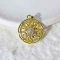 Golden sun pendant with cubic zirconia micro-inlay on white ceramic and plush background - Gold Sun Style (1)