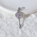 Silver clover key pendant with micro-paxed zircons on a white plush background - Silver Key Clover Style (1)