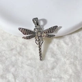 Macro detail of a silver dragonfly pendant with sparkling cubic zirconia inlay and top bail - Dragonfly Silver Full Pave Pendant Only (Without Chain)
