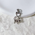 Detailed view of silver girl pendant with black zircon inlays on white display - Silver Black Zircon Girl Style (2)