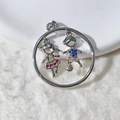 Detail of silver pendant with girl and boy figures inlaid with colorful zircon stones - Silver Duo Circle Style (5)