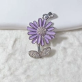 Macro detail of purple enamel daisy pendant with pavé cubic zirconia accents in silver - Purple Daisy Silver Finish Style