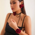 Deep red satin rose choker and earring set shown on model for elegant vintage style - Red