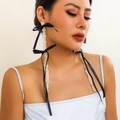 Detailed view of long pearl tassel earrings with black satin bow on model - Extra Long Pearl Tassel Bowknot Earrings / Black (3018)