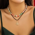 Close-up of a festive double-layer beaded necklace with a gold Christmas tree pendant - Christmas Tree Pendant Style (4462K7)