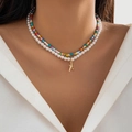 Detail of layered bohemian necklace featuring white pearls, colorful beads, and a starfish pendant - Double Layer Starfish Pearl Style / Gold And Colorful Beads