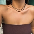 Double-layered bohemian bead necklace in warm brown tones worn as a layered choker - Dark Brown Amber Beads