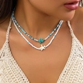 Double-layered blue and white bead necklace featuring starfish pendants on female neck - Double Layer Starfish Style / Blue And White Beads