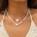 Bohemian layered beaded necklace featuring turtle and starfish charms in earthy brown and white - Double Layer Turtle Starfish Style / Brown And White Beads