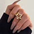 Minimalist gold hollow star ring for women featuring a polished geometric metal design - Hollow Star Ring (0701) / Gold Style (0701)