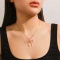 Elegant gold choker necklace featuring a bow pendant and delicate beaded chain - Specification / Gold (6242)
