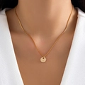 Gold letter L necklace with round pendant and box chain worn on model neck - Letter L - Gold