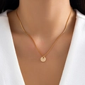 Minimalist gold necklace featuring a round pendant with letter Y engraving on a box chain - Letter Y - Gold
