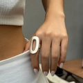 Modern minimalist silver oversized wrinkled disc ring with a matte finish texture - Oval Hollow Style (0712) / Matte Silver