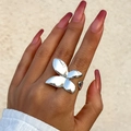 Polished silver butterfly double-finger ring worn by a model on her hand with natural light - Butterfly Shape / Silver (0721)