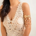 Detail of gold bohemian arm cuff featuring pyramid studs and layered coin tassels - Gold Rivet Coin Style (0327)