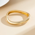 Detailed view of irregular wavy gold bracelet with polished finish and hinge closure - Minimalist Oval Bangle (2391) / 03 Gold