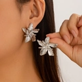 Close-up of silver brushed flower stud earrings featuring five-petal floral design and texture - Flower Style - Silver (3258)