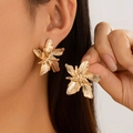 Chic gold floral earrings with textured liquid metal petals shown on model - Flower Style - Gold (3258)