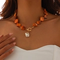 Detail of bohemian orange stone beaded necklace with golden OT clasp and baroque pearl pendant - Orange Necklace(6639)