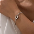 Detail of silver link chain bracelet with a large circular spring clasp on female wrist - Silver (2461)