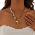 Bohemian starfish necklace with natural shells, pearls and gold chain on model - Asymmetric Starfish Pearl Style (6660)