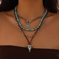 Detail of layered bohemian necklace featuring a bull head pendant and turquoise beads - Bull Head And Sunflower (22)