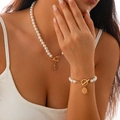 Goldenes Perlen-Schmuckset mit Schneeflocken-Anhängern und eleganten OT-Verschlüssen - Schneeflocken-Stil (5303K3)